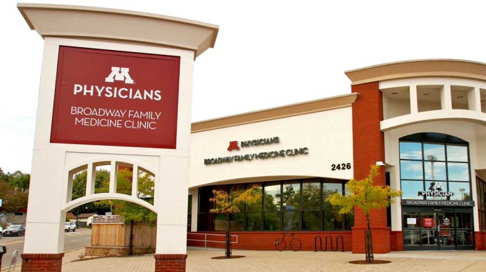 Clinic building with "M Physicians Broadway Family Medicine Clinic" sign.